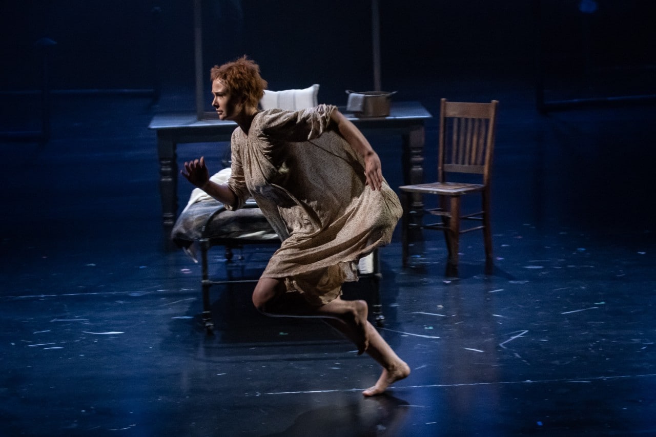 photo of a young female actor running on stage