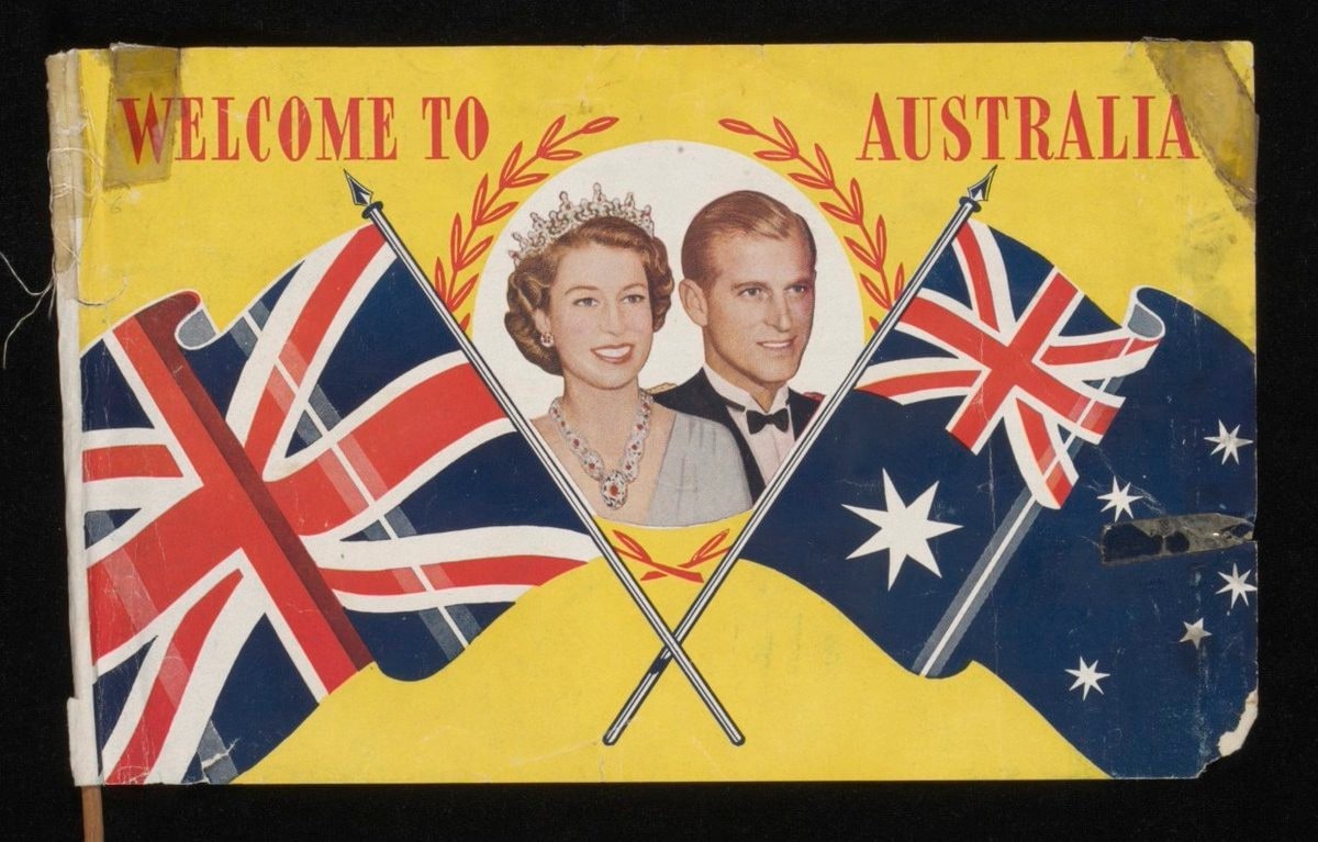 Picture of a souvenir flag of the Royal visit to Australia, 1954. The flag shows the smiling faces of a young Queen Elizabeth and Prince Philip with the words Welcome to Australia. It also shows the Australian flag and Union Jack flag crossing over together to link them in friendship. 