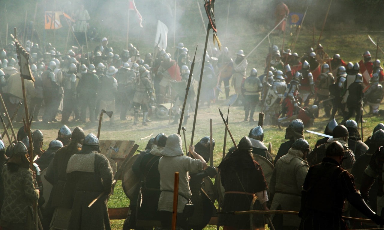 photo of a battle scene with people dressed in full armour