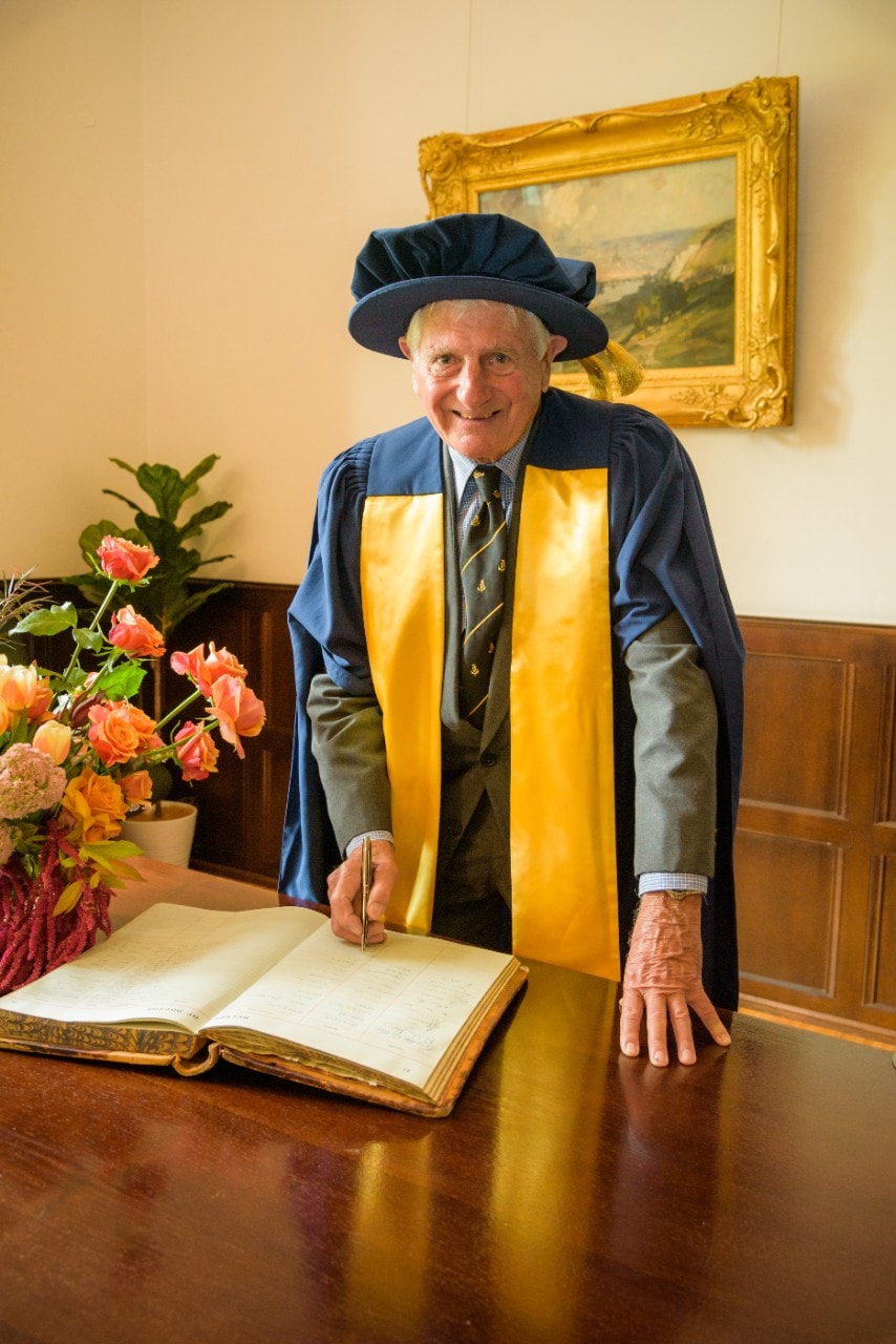 Dr Roderick Kater signing the 'Harry Potter' book at the ceremony where he was awarded an Honorary Fellowship
