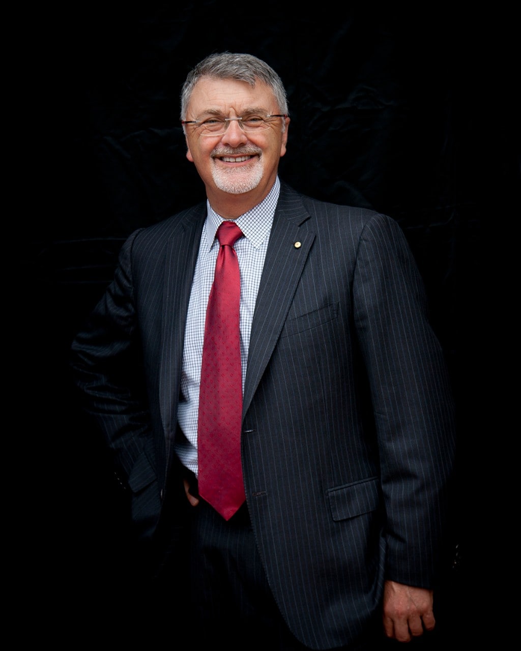 photo of Professor Peter Shergold, an older man in a suit, on a black background
