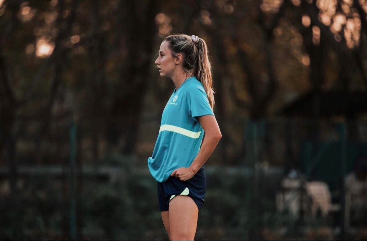 Clare Wheeler in a blue shirt during a training session