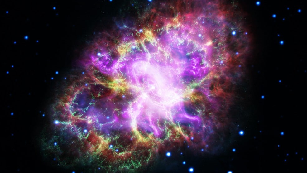 Image of the Crab Nebula where red is radio from the Very Large Array, yellow is infra-red from the Spitzer Space Telescope, green is visible from the Hubble Space Telescope, and blue and purple are X-ray from the XMM-Newton and Chandra X-ray Observatories respectively. NASA/ESA