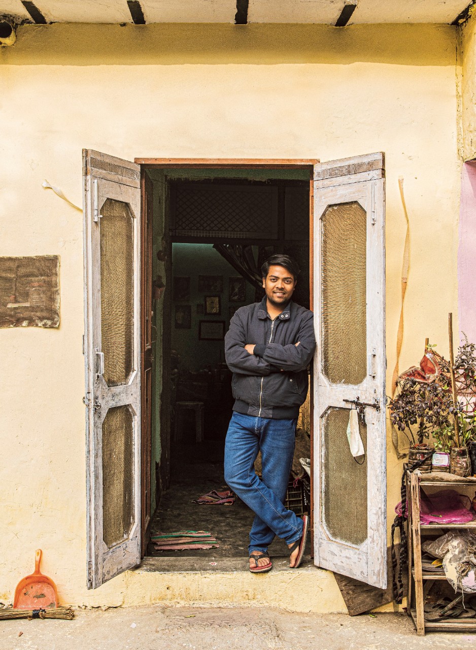 Tushar leaning in a door frame
