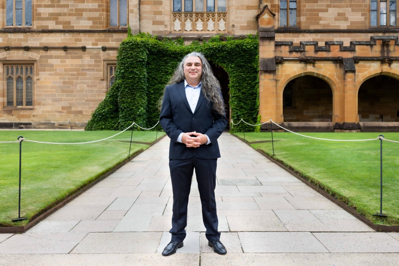 Michael Dagostino standing in the University of Sydney quadrangle