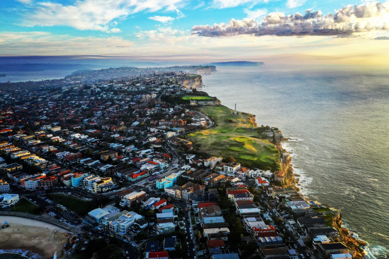 Aerial view of Sydney housing and coastline