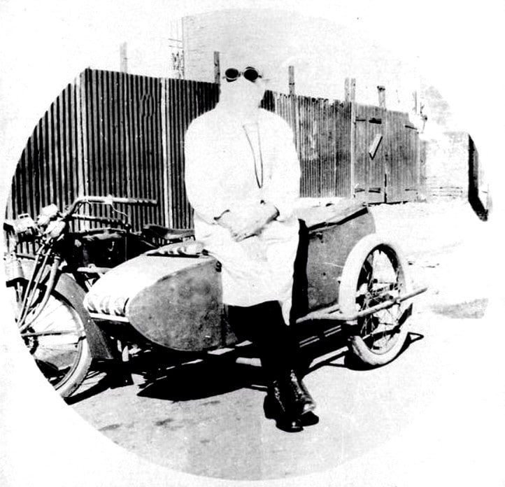 Cawley Madden, medical student, in protective clothing during influenza epidemic