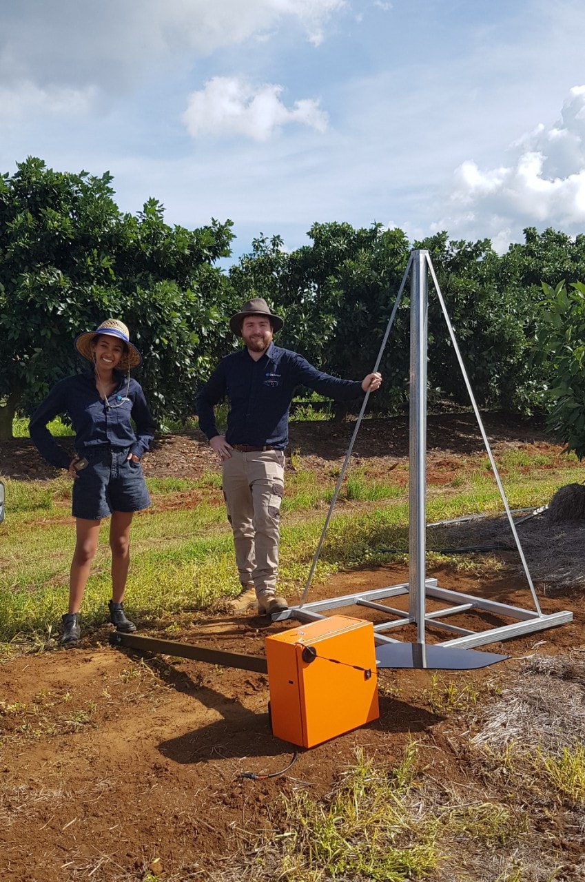 Two engineers with in the field Bioscout farming equipment