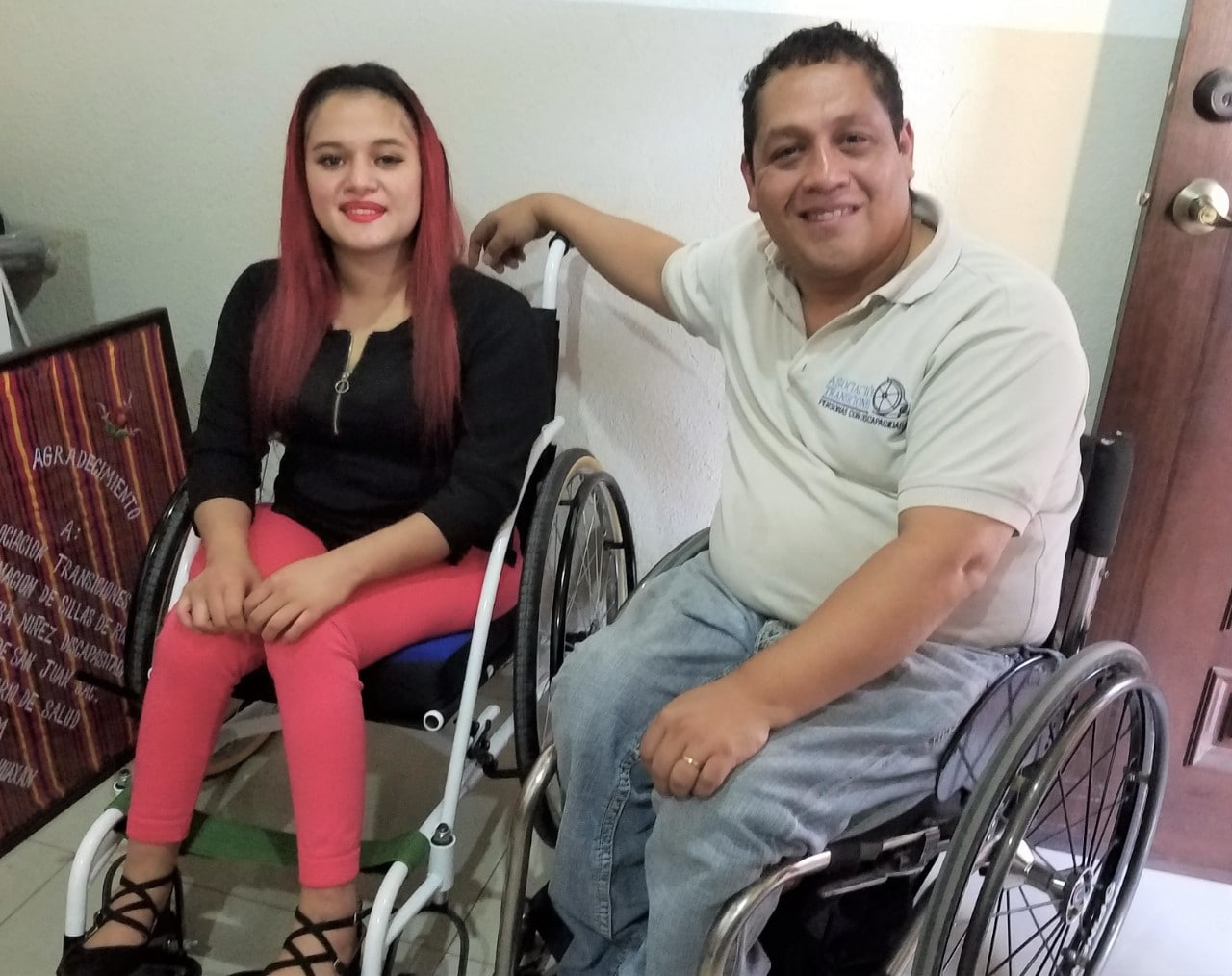 Transitions director Alex Gálvez with gun violence survivor Flory, both seated in wheelchairs