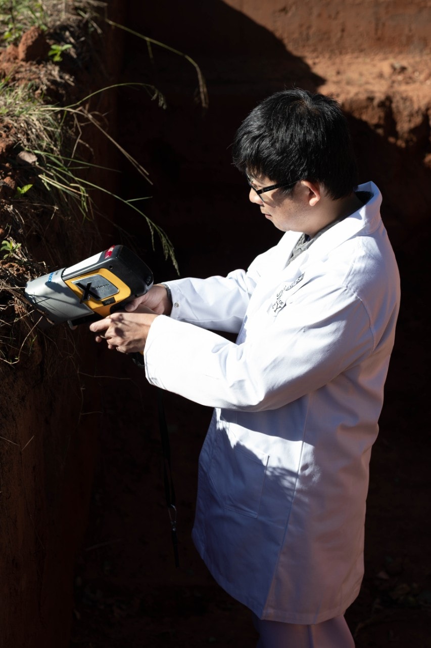 Professor Budiman Minasny using infrared spectroscopy to read light in the soil