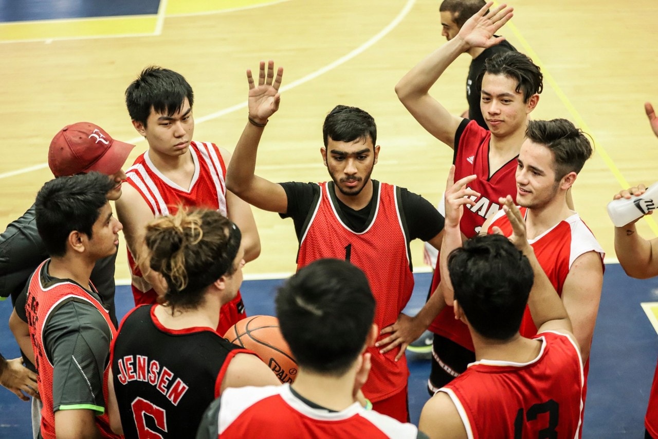 Basketball team huddle