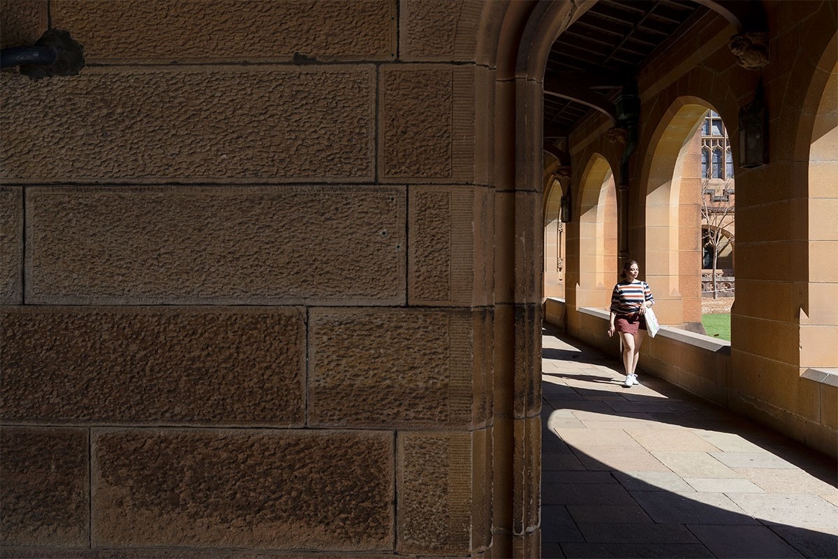 students walking in cloisters