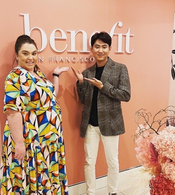 FLS Student Daniel Kim posing in front of Benefit Cosmetics store where he interned
