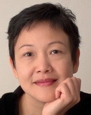 image of an Asian appearance woman with short hair smiling at the camera