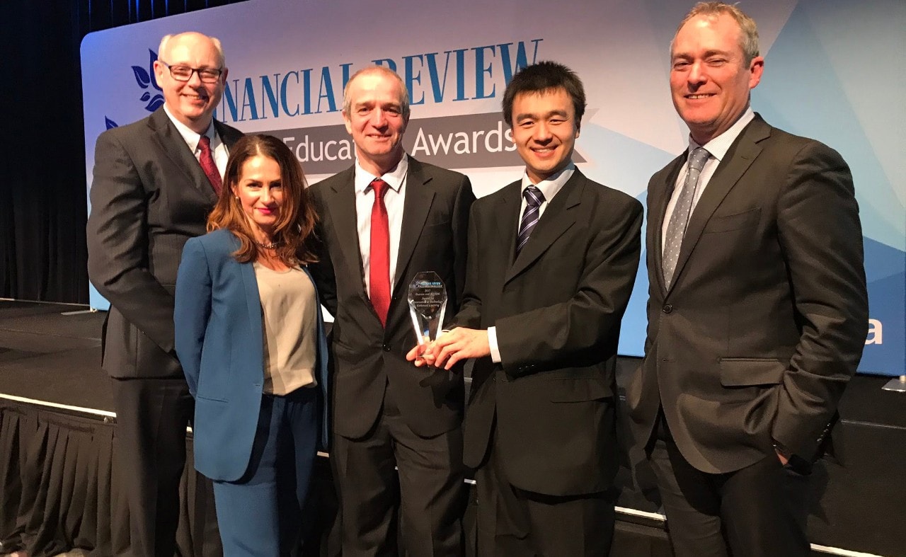 The winning University of Sydney Student Relationship Engagement System team receive their prize from Associate Professor Michael Sankey (far left), Vice President of ACODE, and David Barnett (far right), Managing Director of Pearson. The team are (l-r): Ruth Weeks, Professor Adam Bridgeman and Dr Danny Liu.