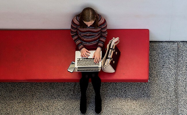 Aerial view of female student studying on a laptop