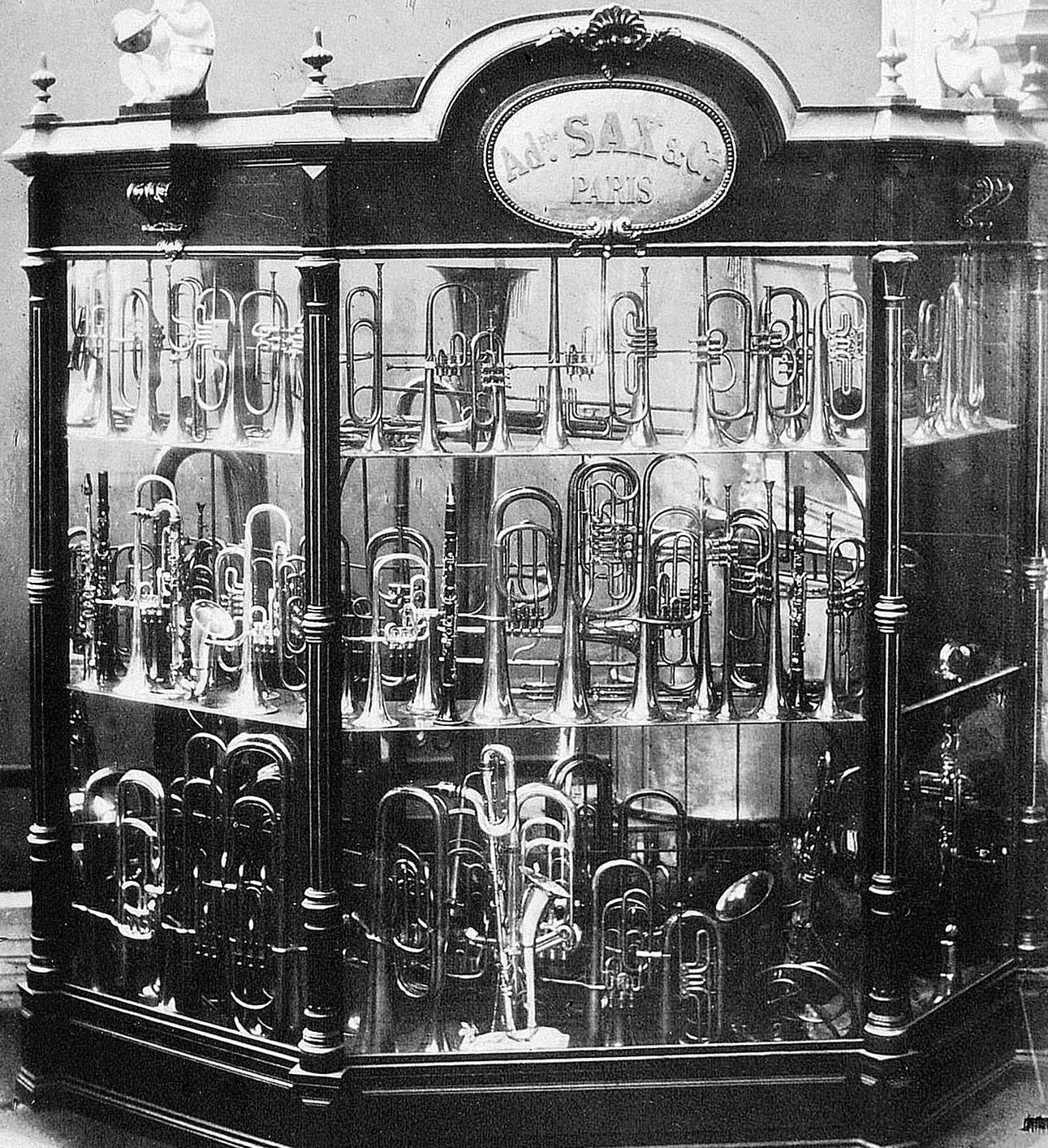 Adolphe Sax and Co., display case of brass instruments, with a saxophone lower front centre, Great Exhibition, London 1851
