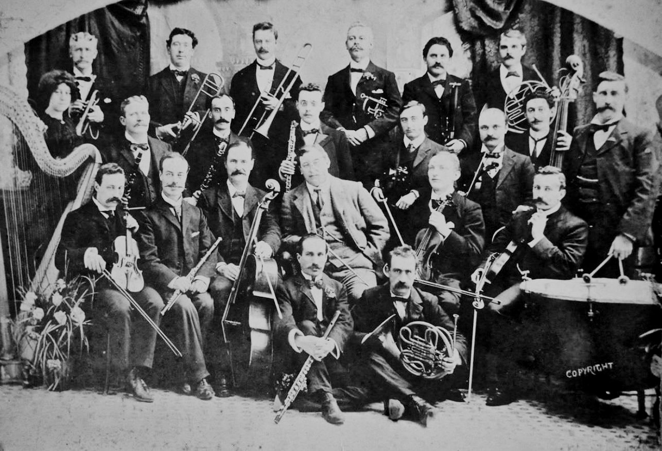 Frederick Randall (with flute, seated, front row, second from left) with the Melba Opera Company orchestra
